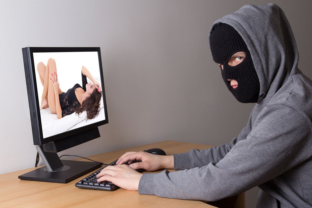Hacker In Mask Stealing Photos From Internet