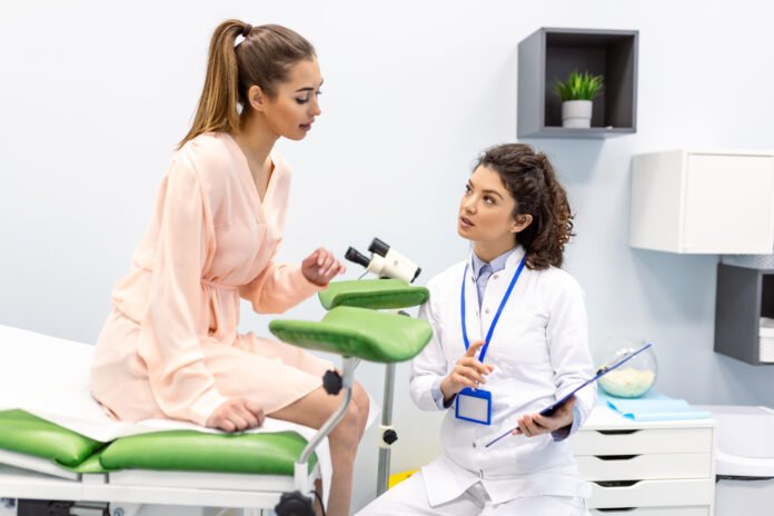 Gynecologist consultation, women's health treatment and diagnosis of diseases of the reproductive system. Checking the female health, exam ovaries, and uterus in the gynecology office.